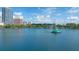 Calm lake view featuring fountain, buildings, and partly cloudy sky at 322 E Central Blvd # 1008, Orlando, FL 32801