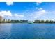 Scenic lake view featuring a fountain and downtown buildings under a blue, partly cloudy sky at 322 E Central Blvd # 1008, Orlando, FL 32801
