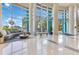 Spacious lobby with comfortable seating areas, large windows offering scenic views, and polished flooring at 322 E Central Blvd # 1008, Orlando, FL 32801