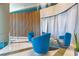Lobby offers three blue chairs around a round table at 322 E Central Blvd # 1008, Orlando, FL 32801