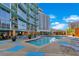 Beautiful pool area with comfortable lounge chairs, lush plants, and a serene atmosphere at 322 E Central Blvd # 1008, Orlando, FL 32801