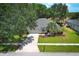Attractive home with a well-manicured lawn, neutral exterior and palm trees at 3835 Rock Hill Loop, Apopka, FL 32712