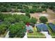Beautiful aerial view of property with mature landscaping and neighborhood amenities at 3835 Rock Hill Loop, Apopka, FL 32712