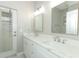 Bright bathroom features a double vanity with quartz countertop and modern fixtures at 3835 Rock Hill Loop, Apopka, FL 32712