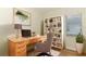 Comfortable home office with natural light, desk space, a bookcase and an ergonomic chair at 3835 Rock Hill Loop, Apopka, FL 32712