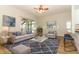 Cozy living room features a large rug, soft lighting, and comfortable seating arrangement at 3835 Rock Hill Loop, Apopka, FL 32712