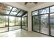 Bright sunroom with tile floors and views of the backyard at 3835 Rock Hill Loop, Apopka, FL 32712