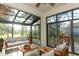 Cozy sunroom with stylish furniture and outdoor views at 3835 Rock Hill Loop, Apopka, FL 32712
