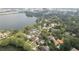 Stunning aerial view of a home situated near a lake and offering beautiful neighborhood views at 702 S Lake Adair Blvd, Orlando, FL 32804