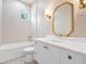Modern bathroom featuring bathtub, shower, and custom mirror at 702 S Lake Adair Blvd, Orlando, FL 32804