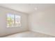 Cozy bedroom featuring large windows, hardwood floors, and neutral paint at 702 S Lake Adair Blvd, Orlando, FL 32804