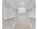 Spacious walk-in closet with custom shelving and storage solutions at 702 S Lake Adair Blvd, Orlando, FL 32804