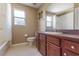 Neutral bathroom with wood cabinets at 9244 Pecky Cypress Way, Orlando, FL 32836