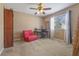 Bedroom with a ceiling fan and large window at 9244 Pecky Cypress Way, Orlando, FL 32836