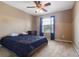 Bedroom with large window and dark blue bedding at 9244 Pecky Cypress Way, Orlando, FL 32836