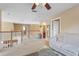 Upstairs hallway featuring a carpeted floor and wooden railing at 9244 Pecky Cypress Way, Orlando, FL 32836