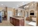 Open concept kitchen and living space with stainless steel appliances and ample natural light at 9244 Pecky Cypress Way, Orlando, FL 32836