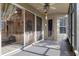 Cozy screened-in patio with a ceiling fan and sliding glass doors, perfect for outdoor enjoyment at 9244 Pecky Cypress Way, Orlando, FL 32836