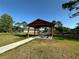 Shaded picnic area with picnic tables and barbecue grills, perfect for outdoor gatherings at 9244 Pecky Cypress Way, Orlando, FL 32836