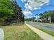 Cypress Chase street view featuring lush landscaping, mature trees, and well-maintained lawns adding to the community's appeal at 9244 Pecky Cypress Way, Orlando, FL 32836