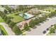 Aerial view of the community pool and recreation area, complete with a pool, playground, and clubhouse at 987 Alston Bay Blvd, Apopka, FL 32703