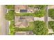 Drone image highlighting the property and its location, with a focus on the backyard, landscaping, and nearby solar panels at 987 Alston Bay Blvd, Apopka, FL 32703