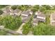 Aerial shot showcasing the property's roof, solar panels, backyard, and proximity to mature tree coverage at 987 Alston Bay Blvd, Apopka, FL 32703