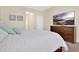Inviting bedroom features a TV, and light neutral walls at 987 Alston Bay Blvd, Apopka, FL 32703