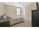 Cozy bedroom features neutral tones, carpet flooring, ceiling fan and lots of natural light at 987 Alston Bay Blvd, Apopka, FL 32703