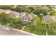 Beautiful home aerial view highlighting the lush landscaping, palm trees, a well-maintained lawn, and corner lot location at 987 Alston Bay Blvd, Apopka, FL 32703