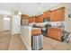 Well-equipped kitchen features granite countertops, stainless steel appliances, and ample cabinet space at 987 Alston Bay Blvd, Apopka, FL 32703