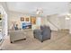 Cozy living room boasts neutral tones, comfortable furniture, and plenty of natural light at 987 Alston Bay Blvd, Apopka, FL 32703