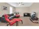 Spacious living room with a ceiling fan, carpet floors, and a cozy seating area at 987 Alston Bay Blvd, Apopka, FL 32703