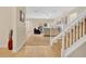 Inviting living area with neutral carpet, a staircase, and comfortable seating arrangement at 987 Alston Bay Blvd, Apopka, FL 32703