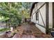 View of backyard and back of house, landscaping, patio, and greenery at 1000 E Anderson St, Orlando, FL 32801