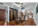 Cozy dining area with a glass table and chairs, next to built in cabinets with a peek to the kitchen at 1000 E Anderson St, Orlando, FL 32801
