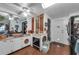 Bright, retro kitchen features white cabinetry, lots of countertop space, and a unique oven space at 1000 E Anderson St, Orlando, FL 32801