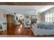 Bright living room with hardwood floors, a brick fireplace, and plantation shutters, creating a cozy atmosphere at 1000 E Anderson St, Orlando, FL 32801