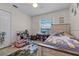 Comfortable bedroom featuring a ceiling fan and ample storage at 10119 Bayard Ct, Orlando, FL 32836