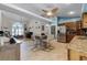 Spacious open kitchen featuring granite countertops and a modern stainless steel refrigerator at 10119 Bayard Ct, Orlando, FL 32836