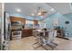 Bright kitchen featuring an eat-in kitchen island, stainless steel appliances, and tile flooring at 10119 Bayard Ct, Orlando, FL 32836