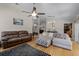 Inviting living room with hardwood floors, plush seating, and open access to other rooms at 10119 Bayard Ct, Orlando, FL 32836