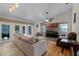 Spacious living room with hardwood floors, high ceilings, and a ceiling fan at 10119 Bayard Ct, Orlando, FL 32836