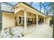 Large covered patio featuring a ceiling fan, ample seating, and easy access to the backyard at 10119 Bayard Ct, Orlando, FL 32836