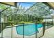 View of the screened in pool area featuring clear blue water at 10119 Bayard Ct, Orlando, FL 32836