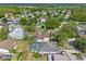 Aerial view of the home with a pool, surrounded by mature trees in a residential neighborhood at 1018 Oceanbreeze Ct, Orlando, FL 32828
