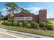 Entrance to Waterford Lakes with brick signage and manicured landscaping at 1018 Oceanbreeze Ct, Orlando, FL 32828
