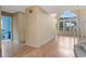 Open living room with vaulted ceilings, wood floors, and a view of the backyard at 1018 Oceanbreeze Ct, Orlando, FL 32828