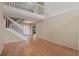 Spacious living room with laminate floors and a staircase leading to the second floor at 1018 Oceanbreeze Ct, Orlando, FL 32828