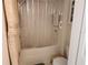 Well-maintained bathroom with a shower/tub combo and neutral tones, and convenient storage at 1021 Siena Park E Blvd # 301, Celebration, FL 34747